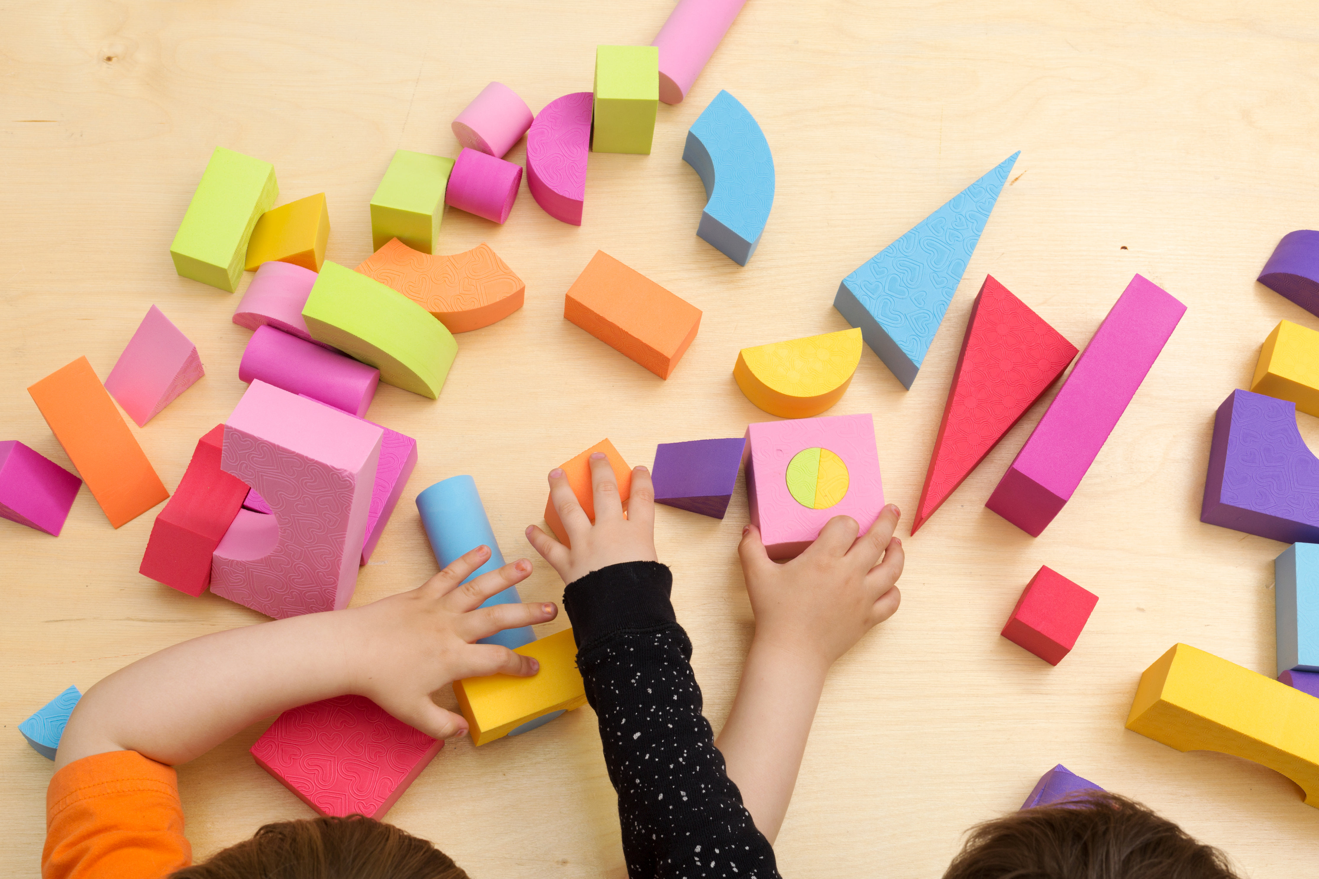 children-sharing-and-playing-with-toys